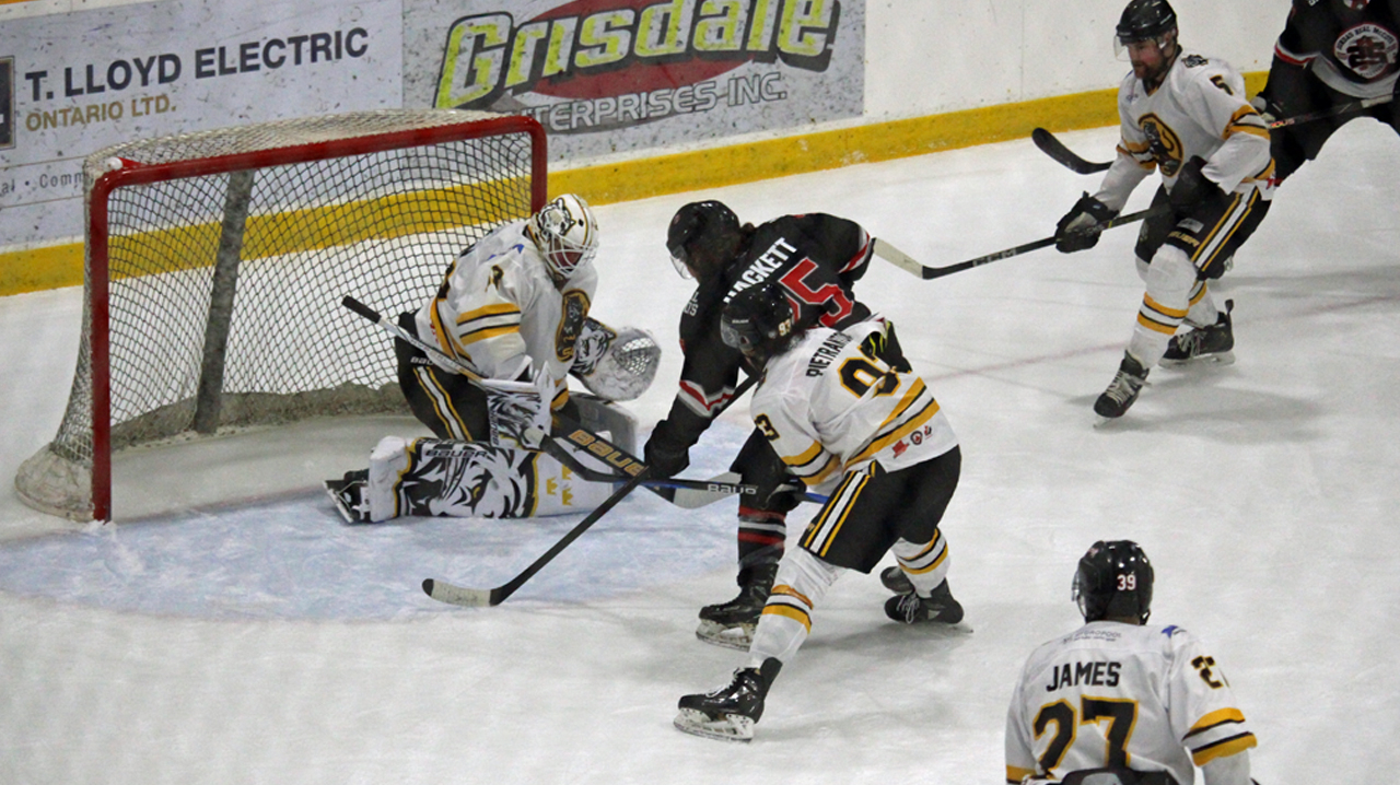 Hackett tries to score on the Tigers for Dundas