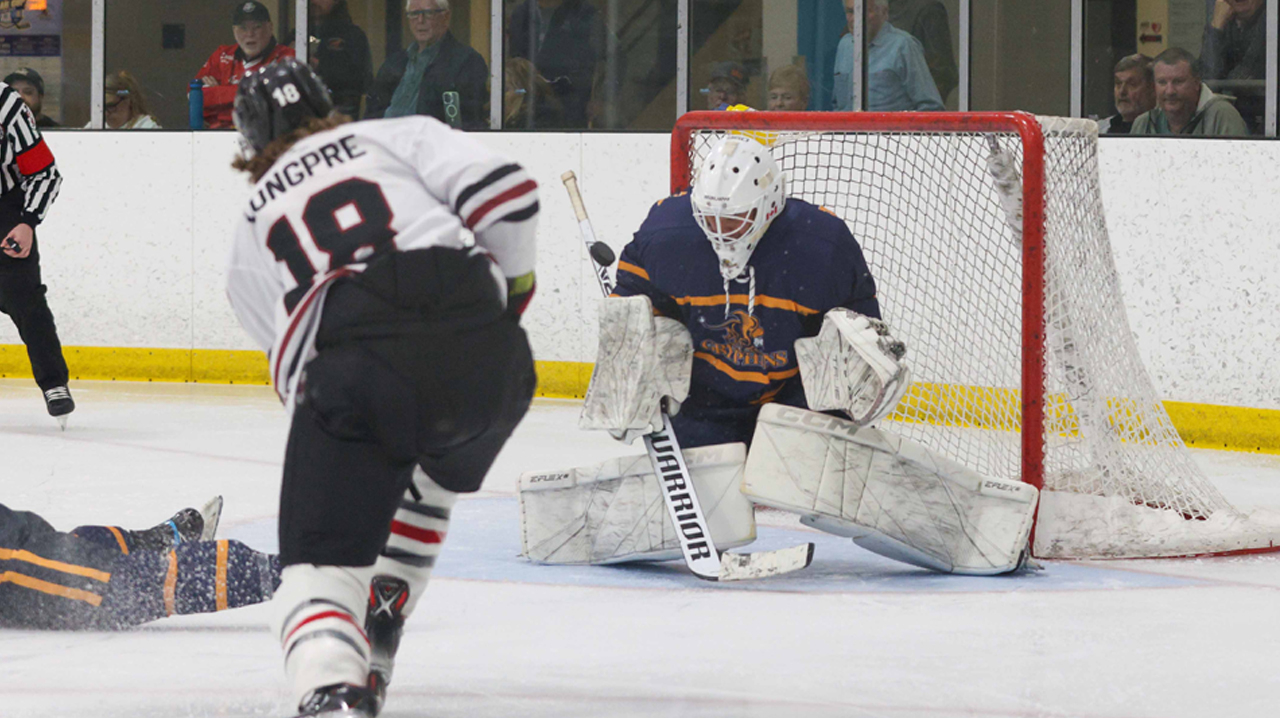 Longpre taking a shot on the Wentworth net.