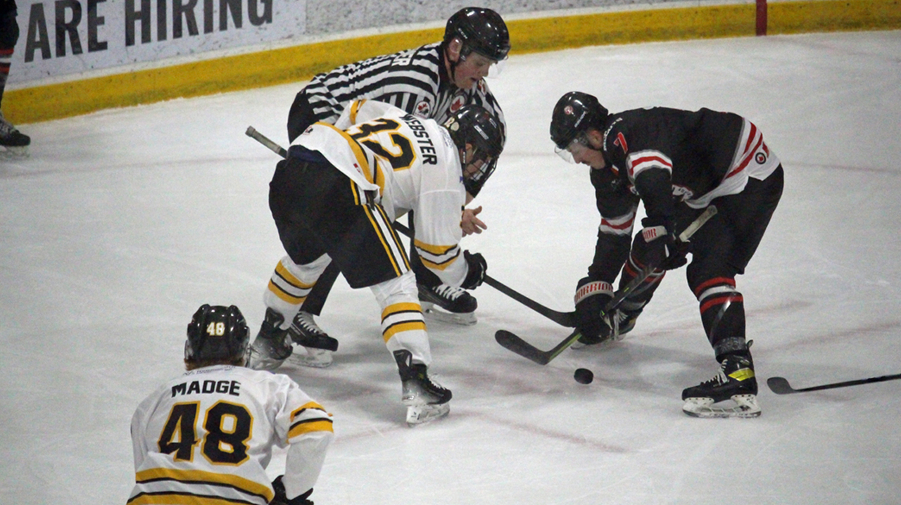 Nolan Sheeran taking a defensive zone faceoff against Stoney Creek