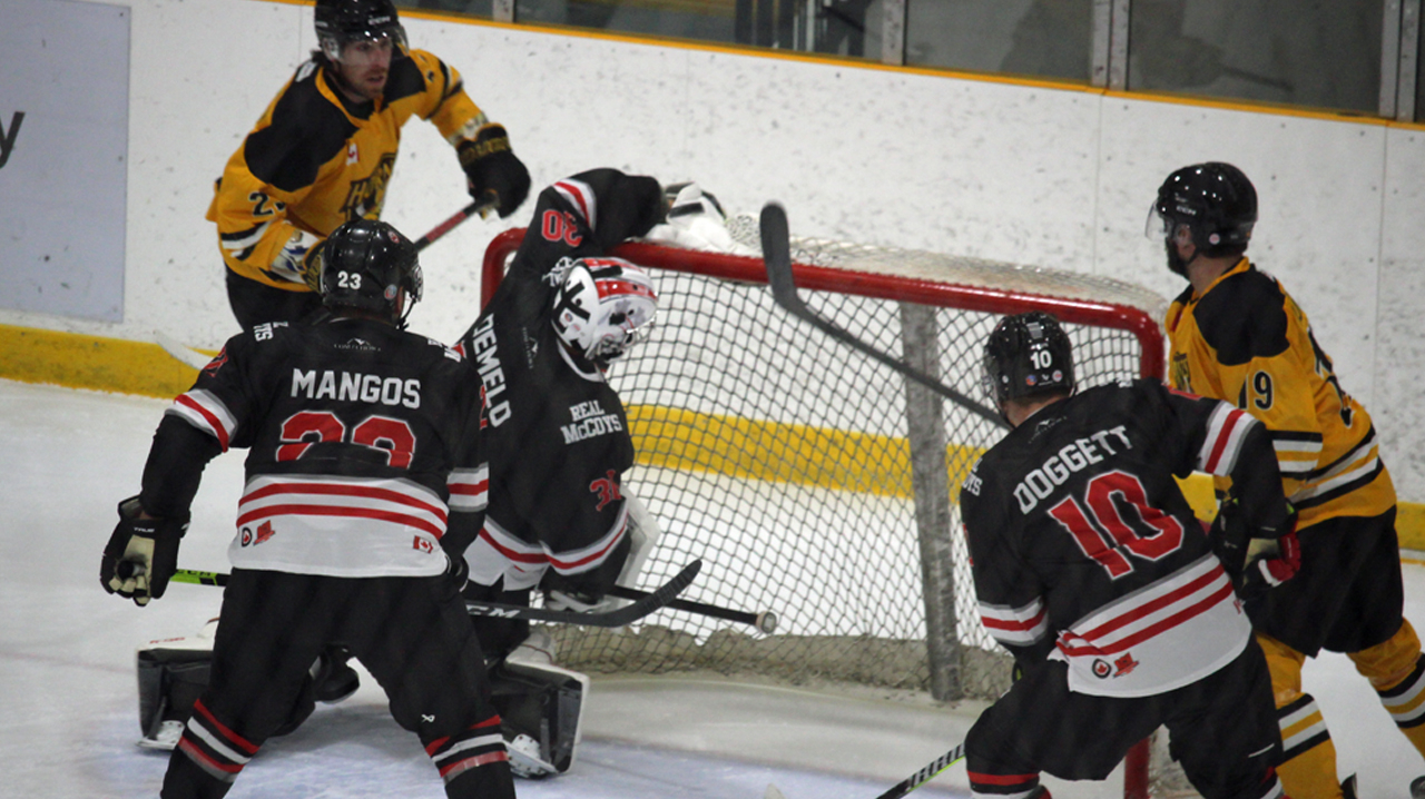 DeMelo covers the puck on top of his net
