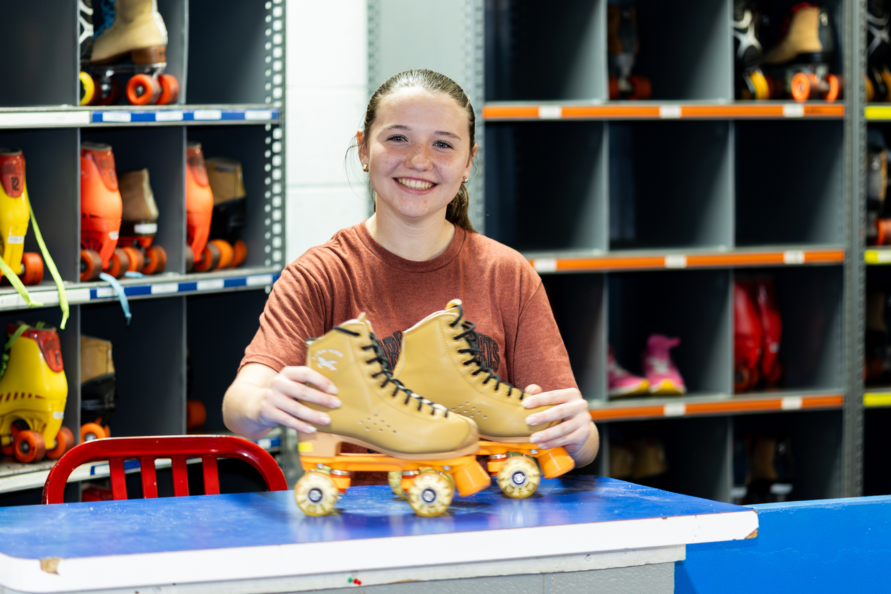 Marple Skate Rental attendant shows off light up wheeks
