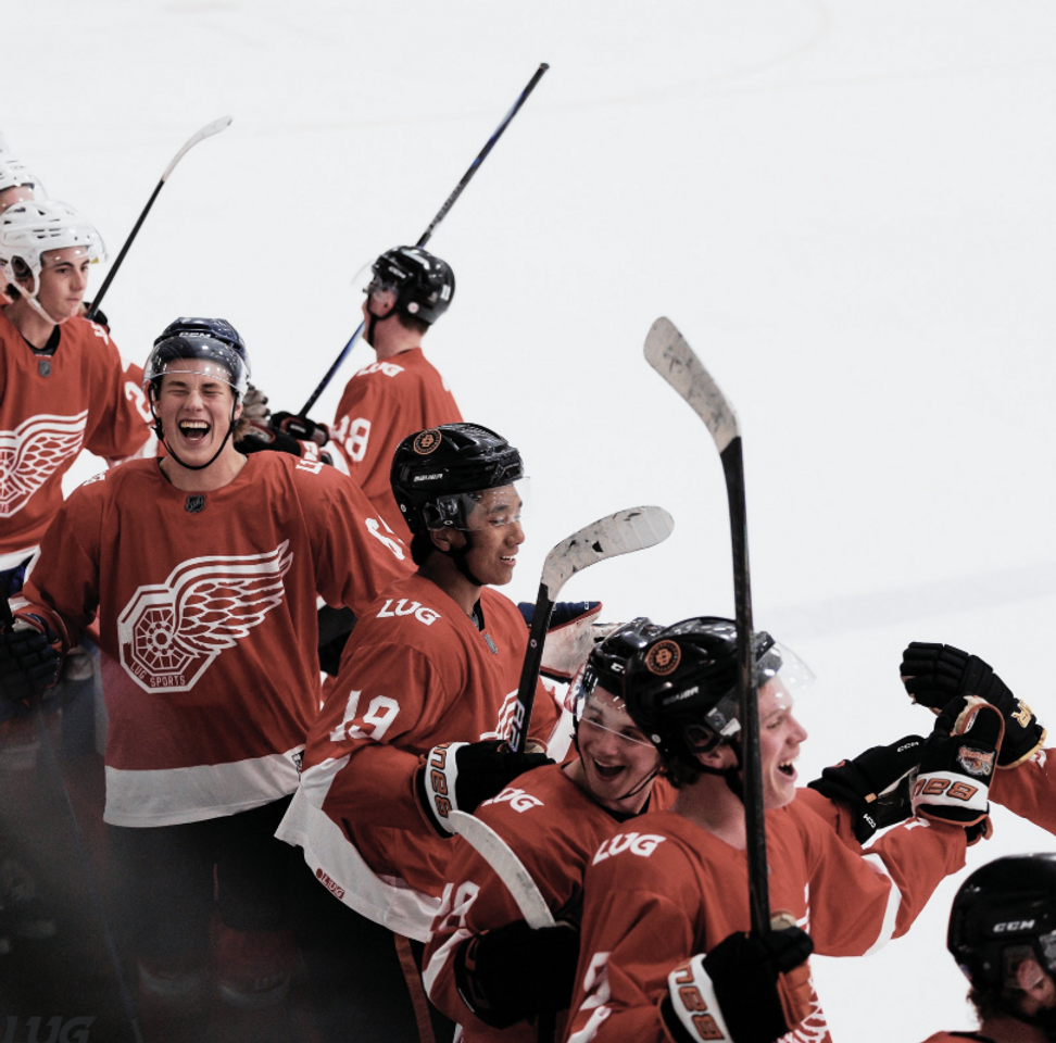 Adult hockey players celebrating in a LUG Sports league