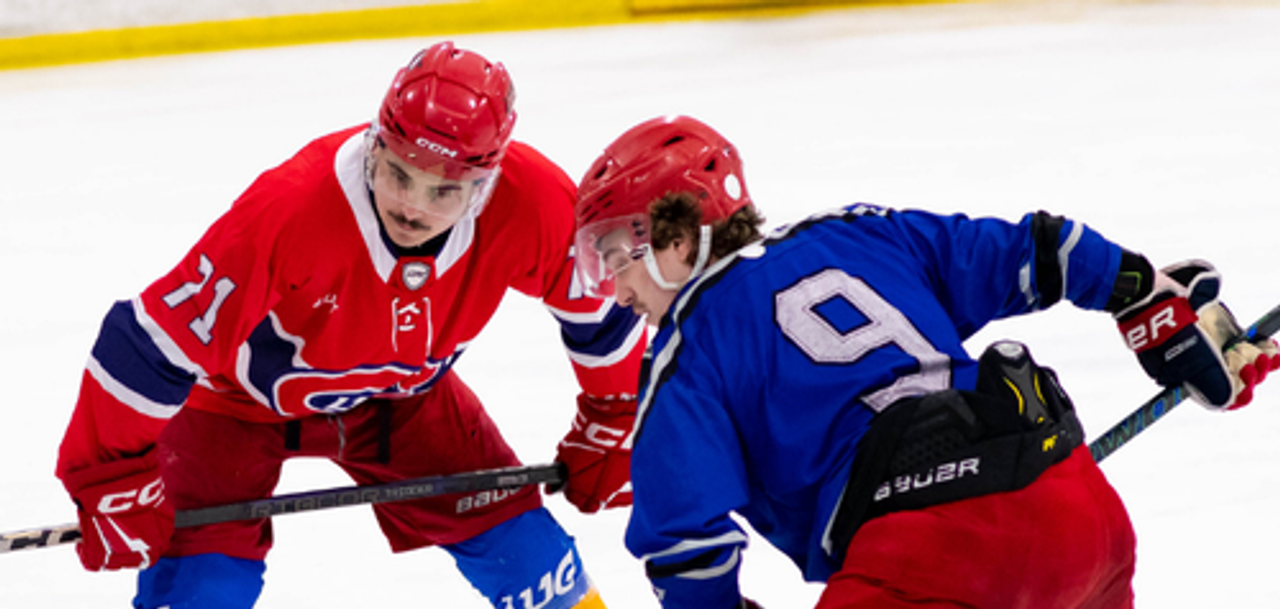 LUG hockey players competing for the puck during a game