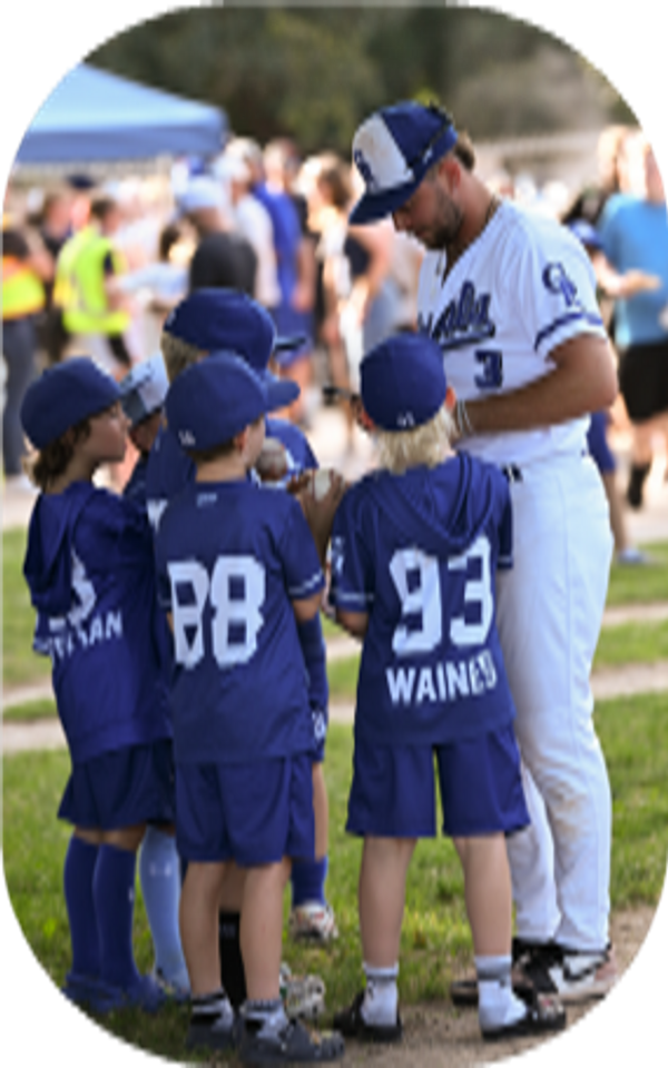 Royals player signing autographs for children