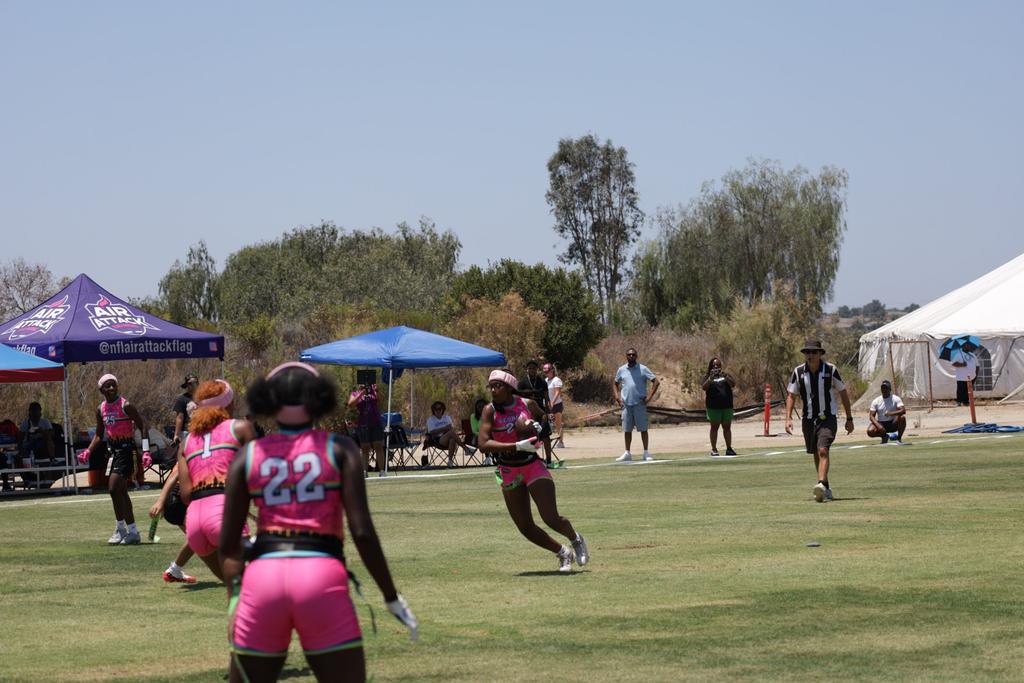 Athletes in live girls flag football competition