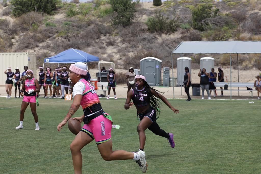 Athletes in live girls flag football competition