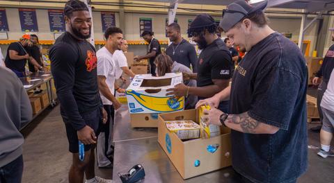 PHOTOS: Albany Firebirds volunteer at Regional Food Bank of Northeastern New York
