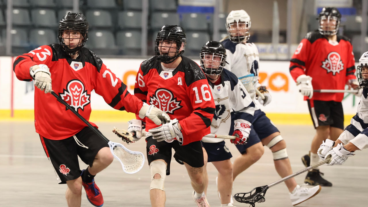 Face-off Action in Final Round-Robin Game Featuring Scotland and Canada