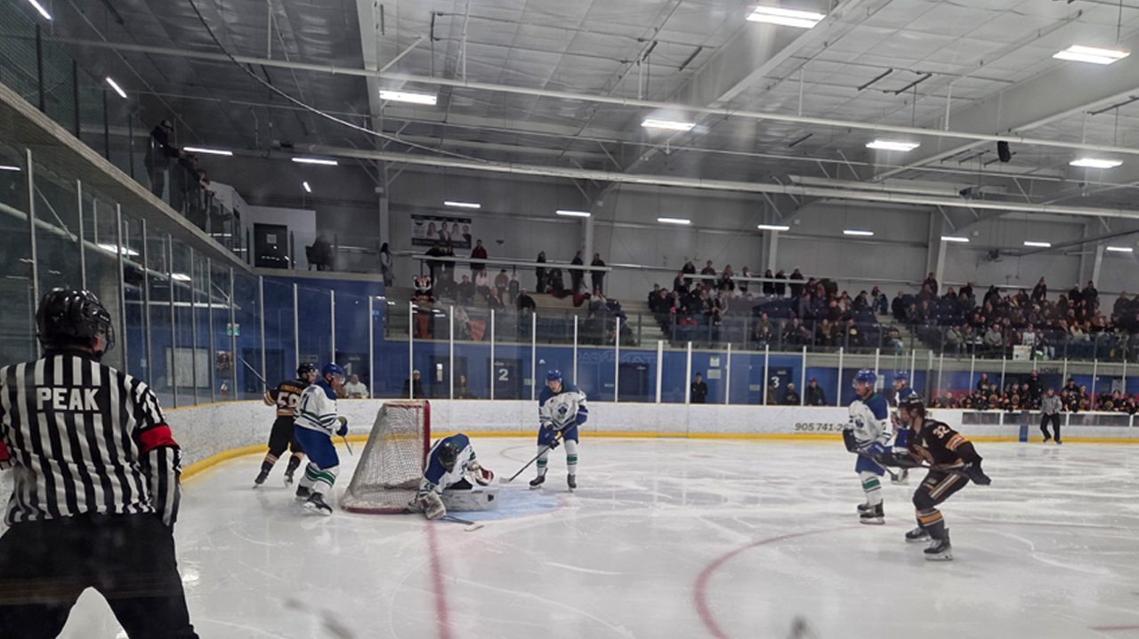 The Saints' Popp covering up the puck at the side of his net