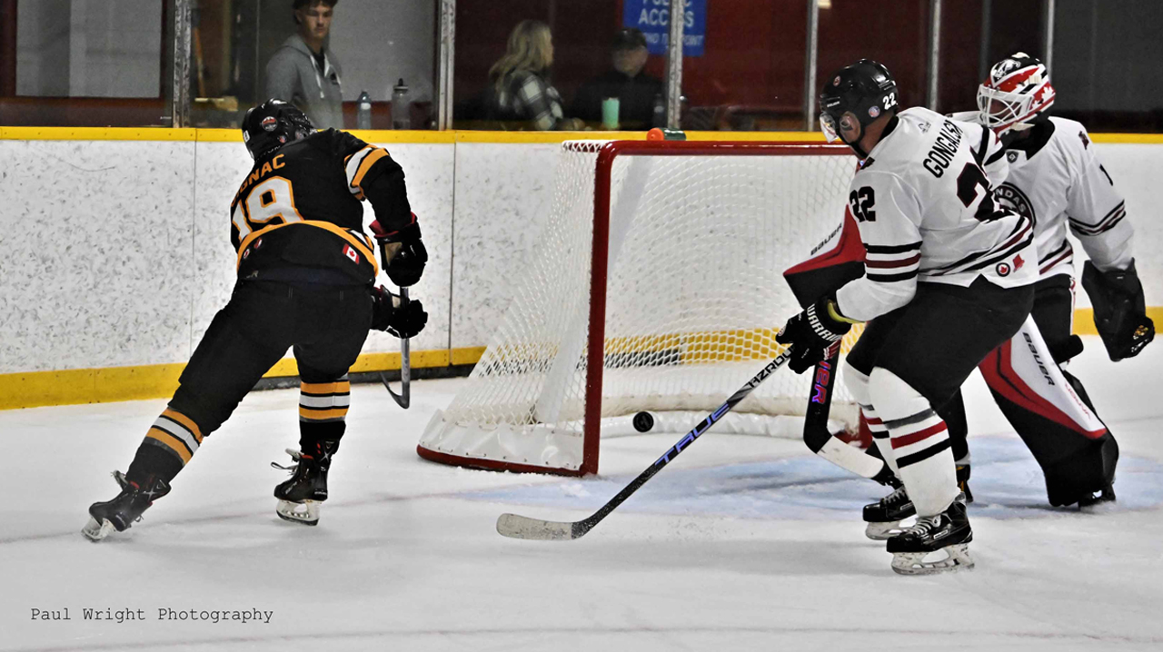 Stoney Creek's Jordan Gignac scores on the Dundas Real McCoys net