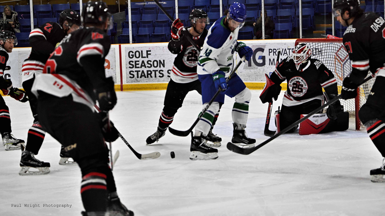 McCoys swarming Saints player in front of goalie Mole