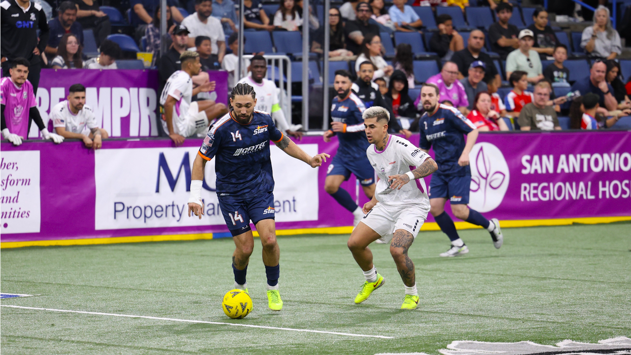 Photo of Justin Stinson defending against Tyler John