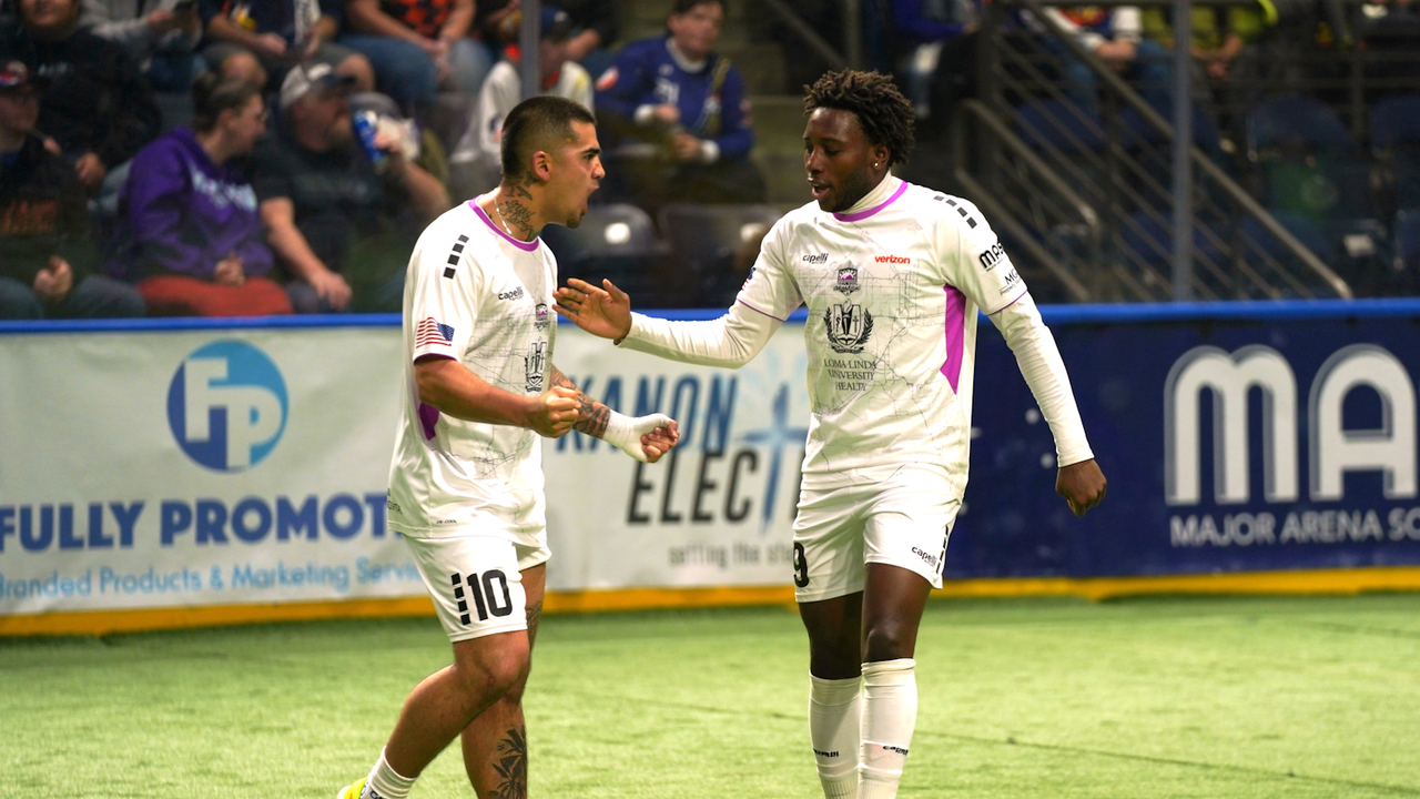 Photo of Justin Stinson & Ali Somow celebrating