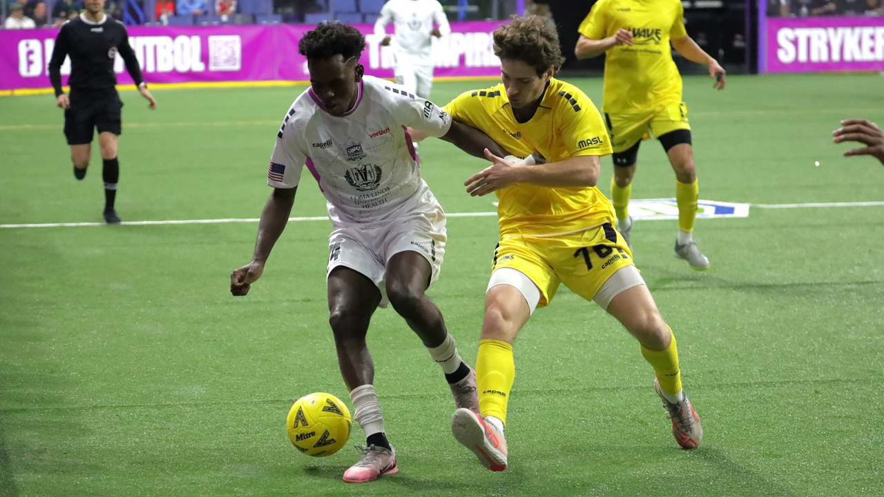 Photo of Empire's Issak Somow shielding the ball from Tanner Hodgson
