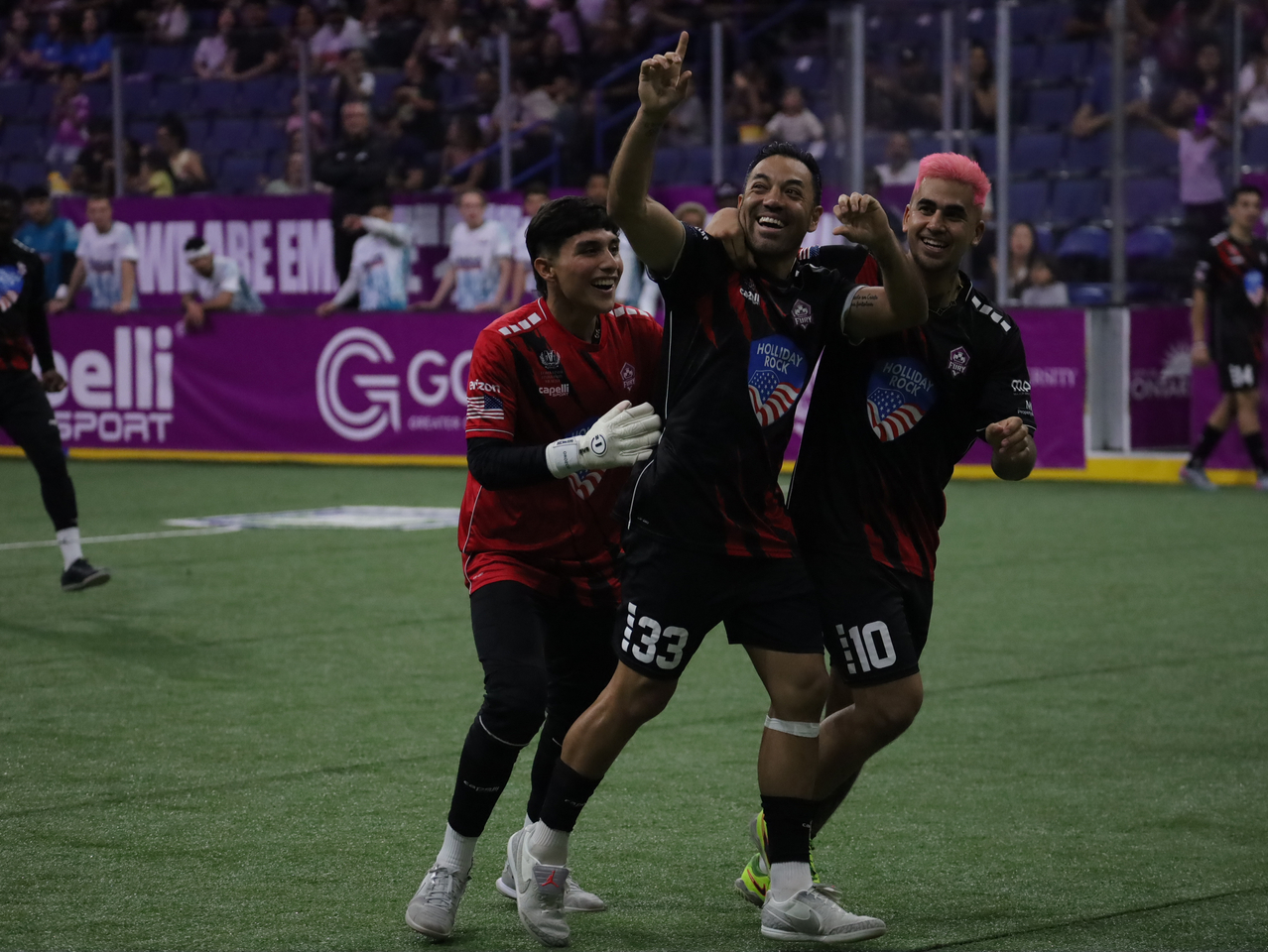 Brina Orozco, Marco Fabian, and Justin Stinson celebrating