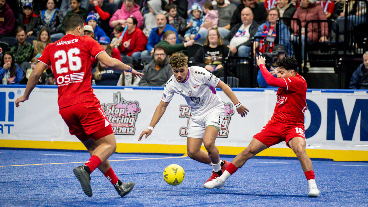 Photo of Mounir Alami fighting for the ball against Kansas City's Rian Marques & Henry Ramirez