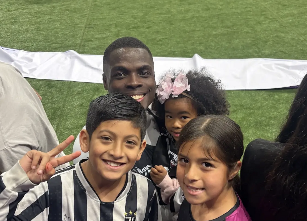 Berto Palmer, Josiah, and Josiah's sister together after a game.