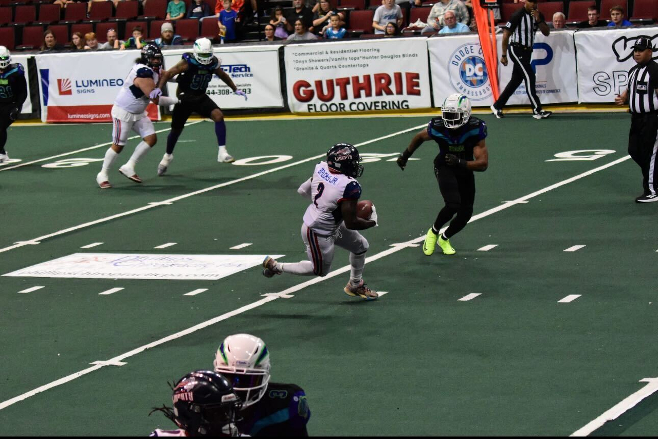 Salina Liberty Running Back Tracy Brooks runs with the ball against the Southwest Kansas Storm