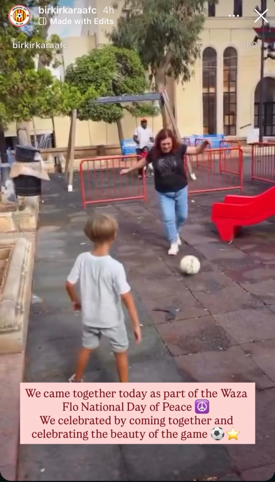A woman and child playing football at Mosta Dome, Malta.