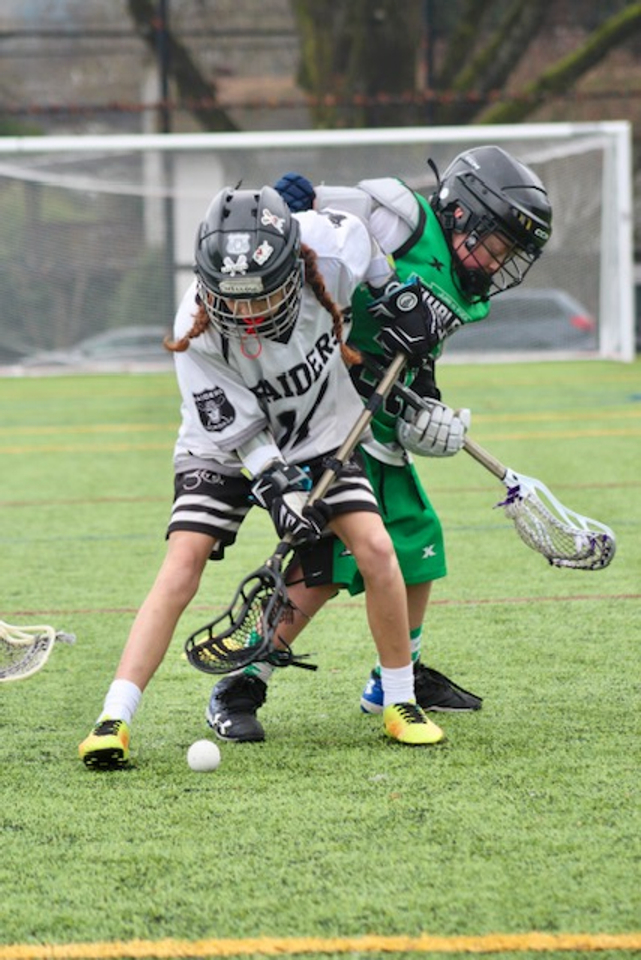 Kids battling for a ground ball