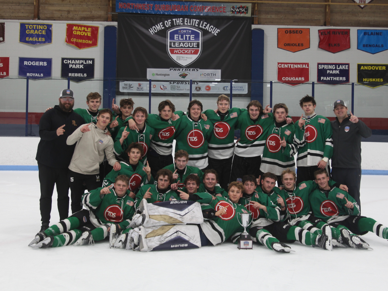 The winning team with the trophy