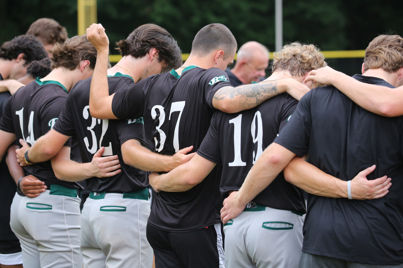 Team pregame huddle by Mark Thalman