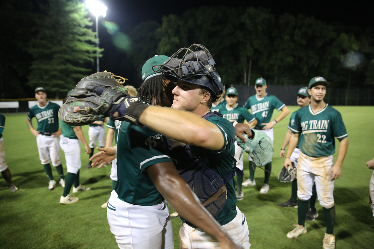 James Gladden (left) hugs Dylan Murphy (right) by Mark Thalman