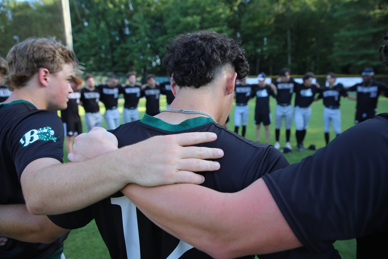 John Martinez in the team pregame circle by Mark Thalman