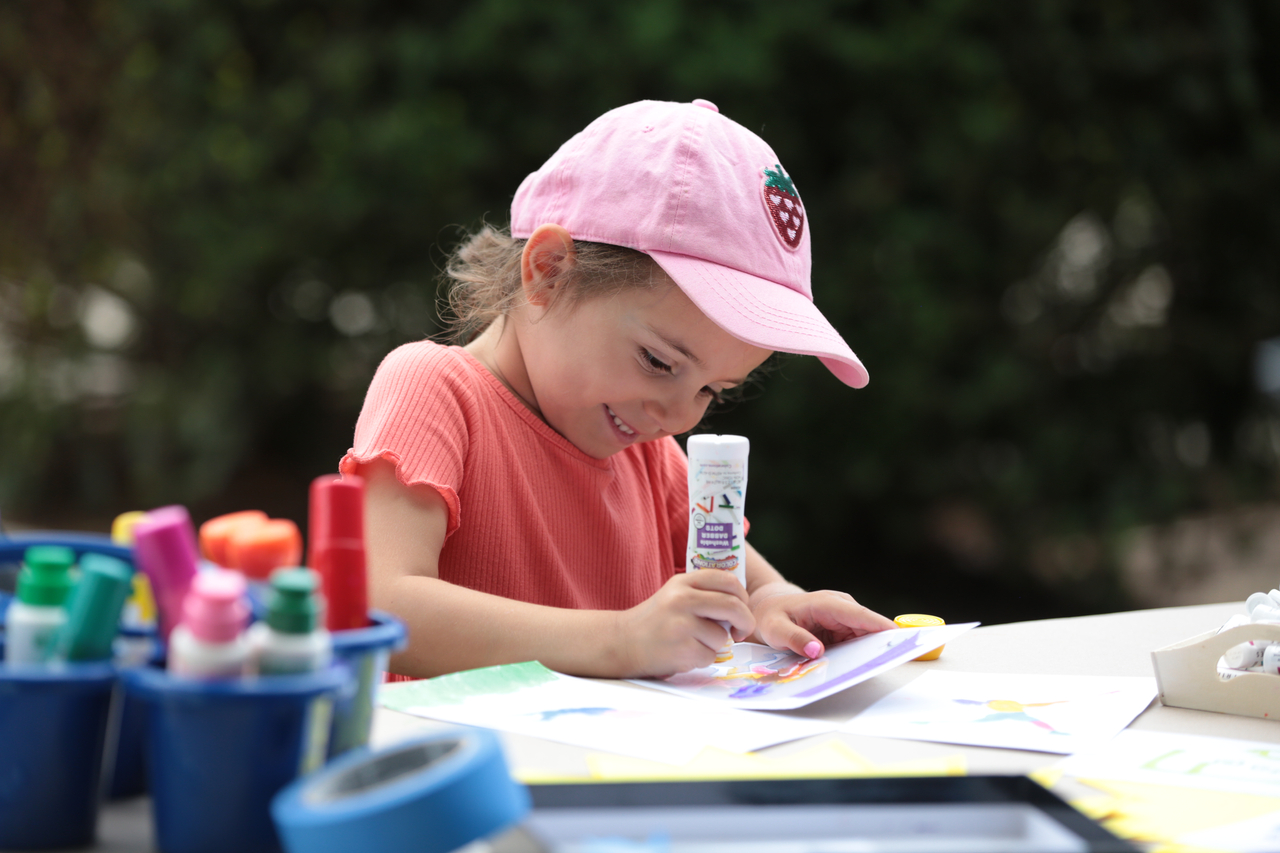 Kid participates in Story Tapestries activity