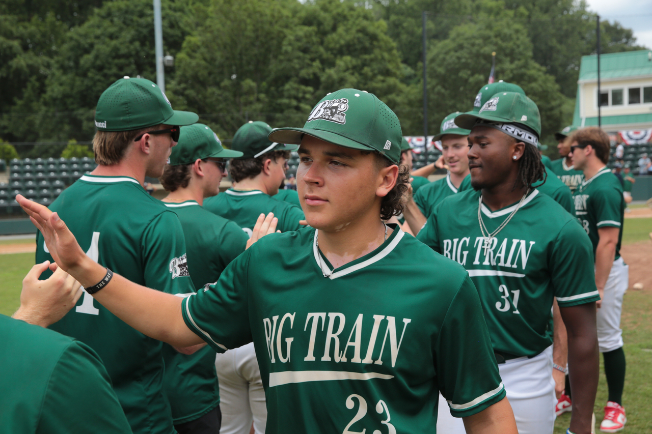 Team handshake line by Mark Thalman