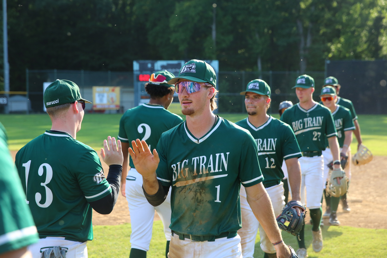 Alex Peltier and company celebrate win by Mark Thalman