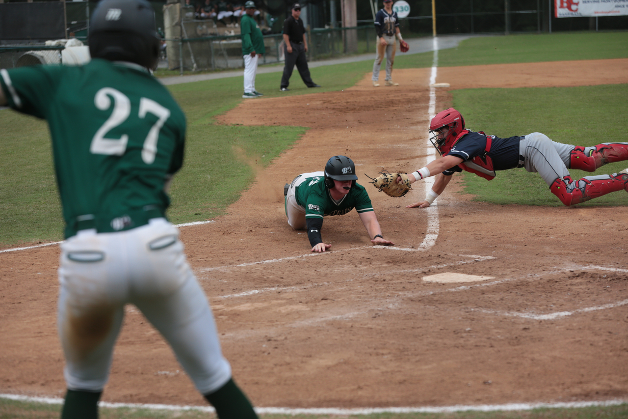 Parker Corbin sliding into home with directions from Brennon Wright by Mark Thalman