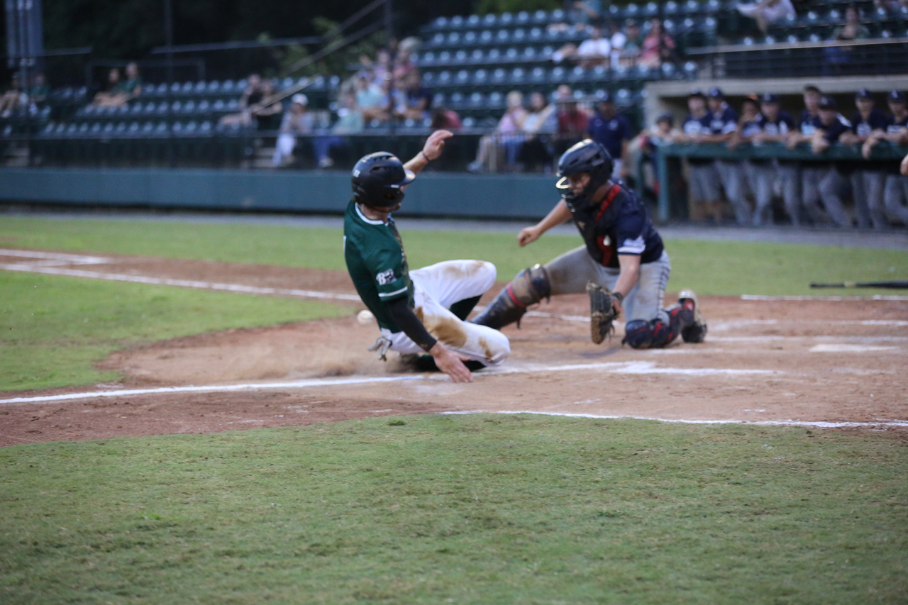 Alex Peltier sliding into home by Mark Thalman