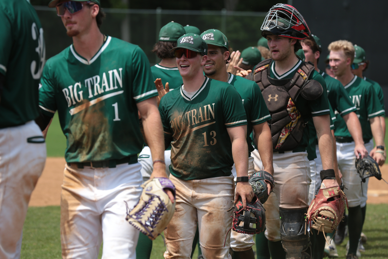 Alex Peltier and Parker Corbin celebrate win with teammates by Mark Thalman